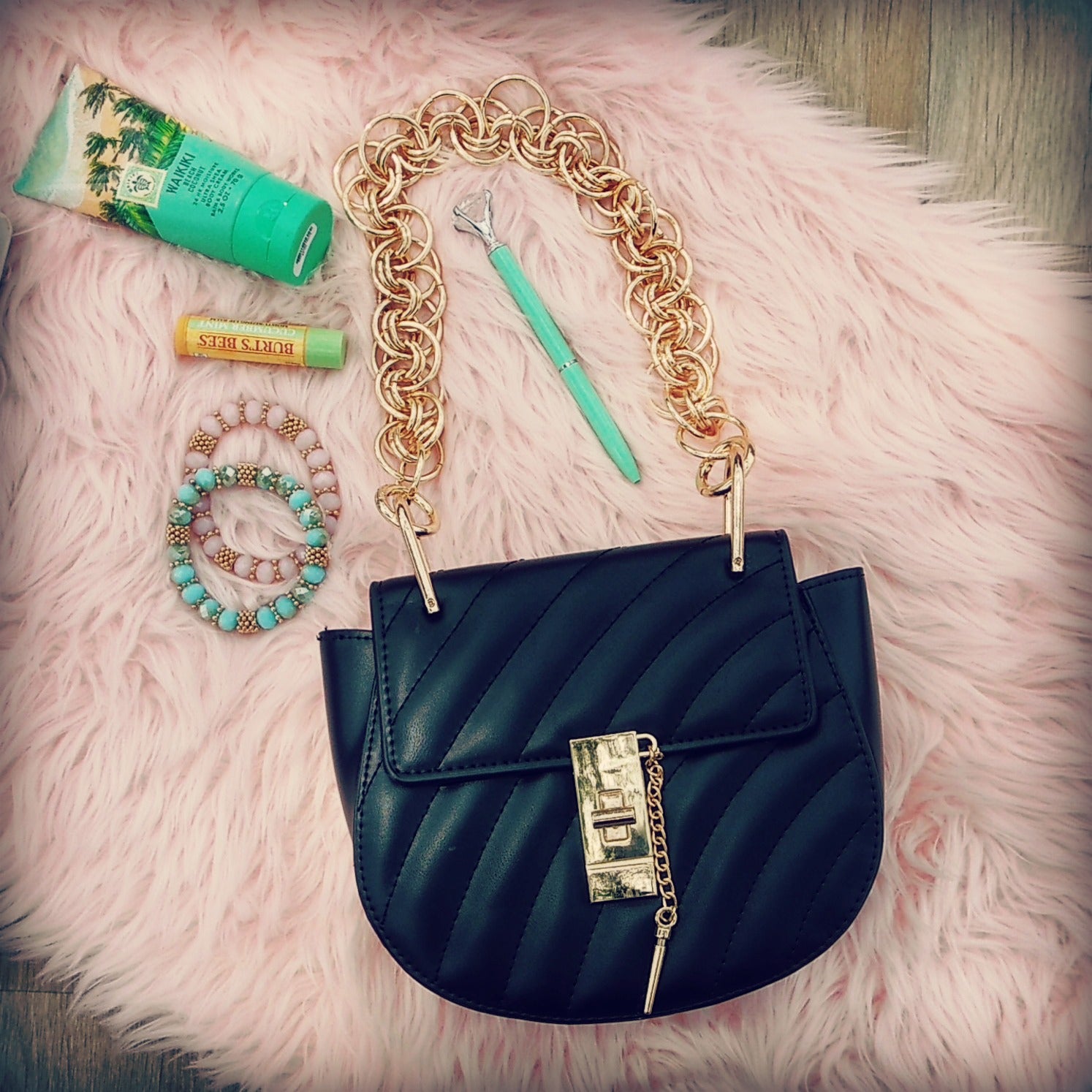 black crossbody bag with gold chain